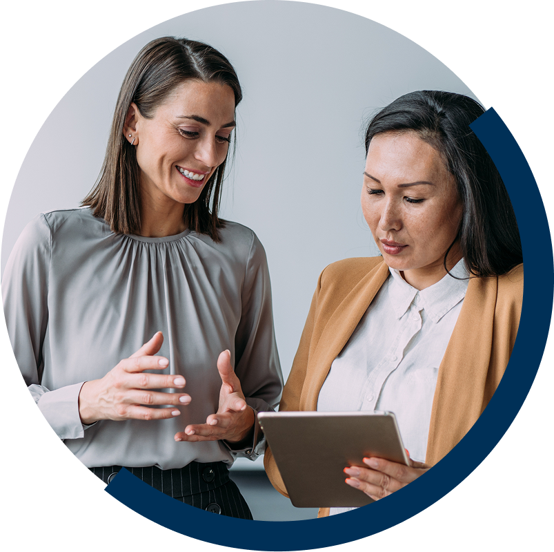 two women talking with tablet