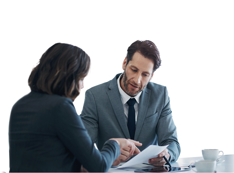Two employees looking at paper
